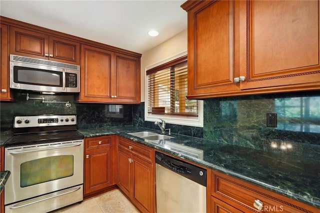 3413 Punta Alta Unit A, Laguna Woods, CA 92637 - kitchen featuring appliances with stainless steel finishes, a sink, decorative backsplash, and dark stone counters