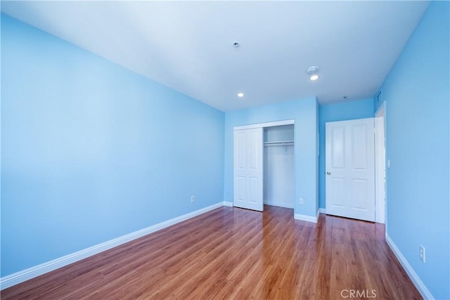 10894 Olinda St Unit 116, Sun Valley, CA 91352 - unfurnished bedroom featuring a closet, wood finished floors, baseboards, and recessed lighting