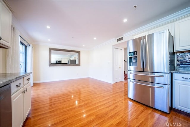 10894 Olinda St Unit 116, Sun Valley, CA 91352 - kitchen with appliances with stainless steel finishes, light wood finished floors, white cabinets, baseboards, and ornamental molding