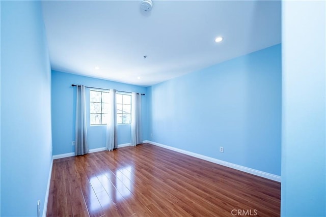 10894 Olinda St Unit 116, Sun Valley, CA 91352 - spare room with dark wood-style flooring, baseboards, a smoke detector, and recessed lighting