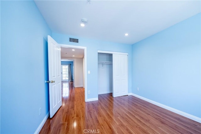 10894 Olinda St Unit 116, Sun Valley, CA 91352 - unfurnished bedroom with wood finished floors, a closet, baseboards, and recessed lighting