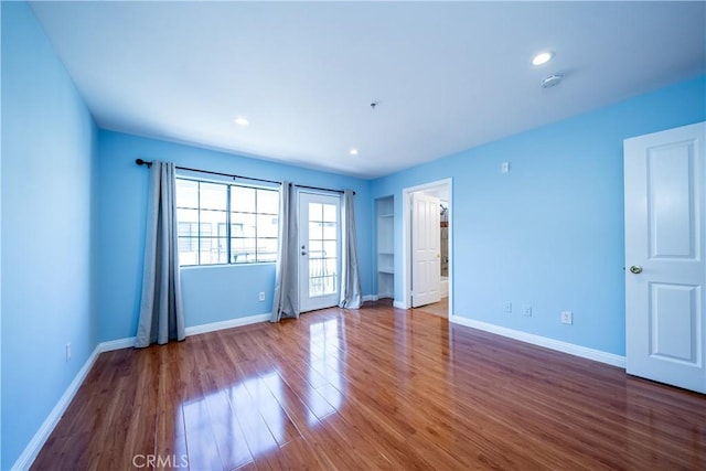 10894 Olinda St Unit 116, Sun Valley, CA 91352 - empty room with wood finished floors, baseboards, a smoke detector, and recessed lighting