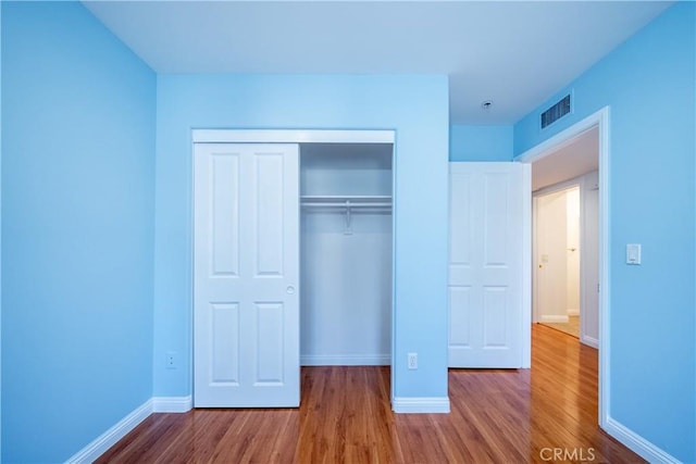 10894 Olinda St Unit 116, Sun Valley, CA 91352 - unfurnished bedroom with wood finished floors, a closet, and baseboards