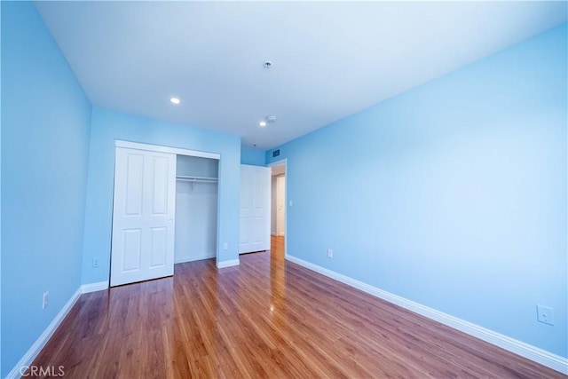 10894 Olinda St Unit 116, Sun Valley, CA 91352 - unfurnished bedroom with a closet, baseboards, wood finished floors, and recessed lighting