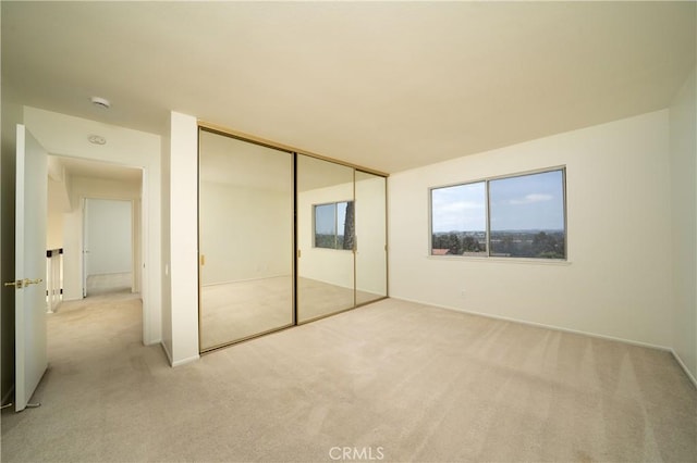 26611 Loma Verde, Mission Viejo, CA 92691 - unfurnished bedroom with light colored carpet, baseboards, and a closet