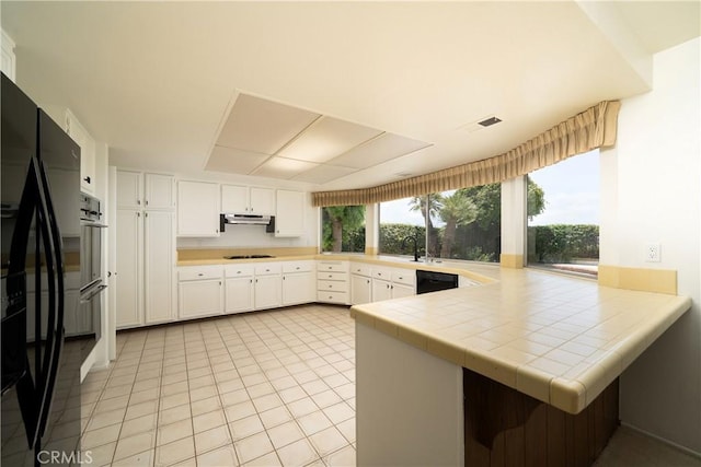 26611 Loma Verde, Mission Viejo, CA 92691 - kitchen featuring plenty of natural light, white cabinets, gas cooktop, and a peninsula