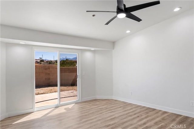 13565 Monterey Rd, Desert Hot Springs, CA 92240 - spare room featuring wood finished floors, recessed lighting, baseboards, and ceiling fan