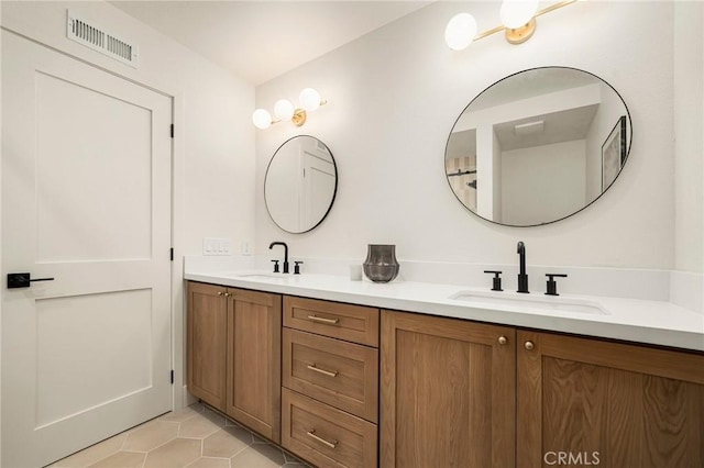 13 Lucero W, Irvine, CA 92620 - full bath featuring double vanity and tile patterned flooring