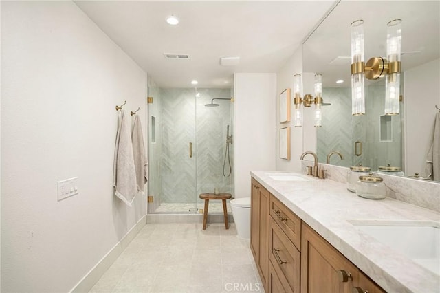 13 Lucero W, Irvine, CA 92620 - bathroom with a shower stall, toilet, double vanity, tile patterned floors, and recessed lighting