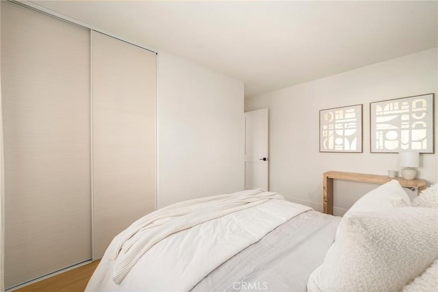 13 Lucero W, Irvine, CA 92620 - bedroom with a closet and wood finished floors