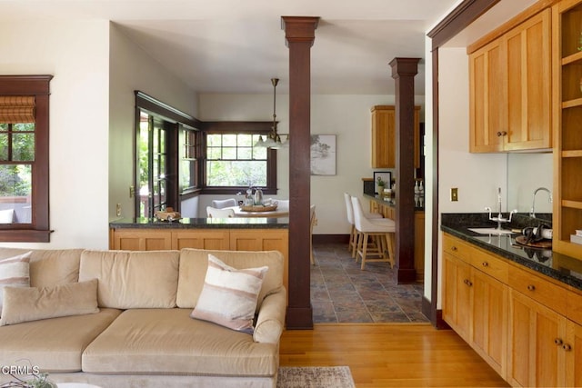 1813 Wayne Ave, South Pasadena, CA 91030 - kitchen featuring open shelves, a sink, open floor plan, decorative columns, and dark wood-style flooring