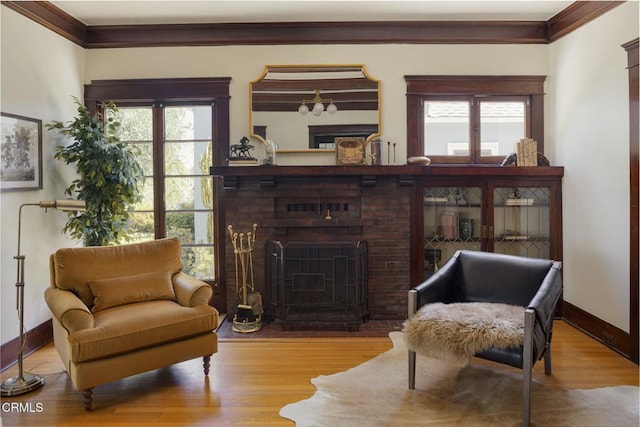 1813 Wayne Ave, South Pasadena, CA 91030 - living area with ornamental molding, wood finished floors, baseboards, and a brick fireplace