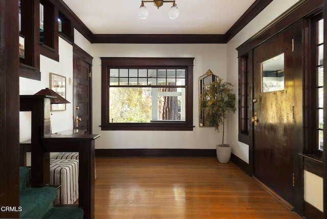1813 Wayne Ave, South Pasadena, CA 91030 - hall featuring baseboards, wood finished floors, ornamental molding, a chandelier, and stairway