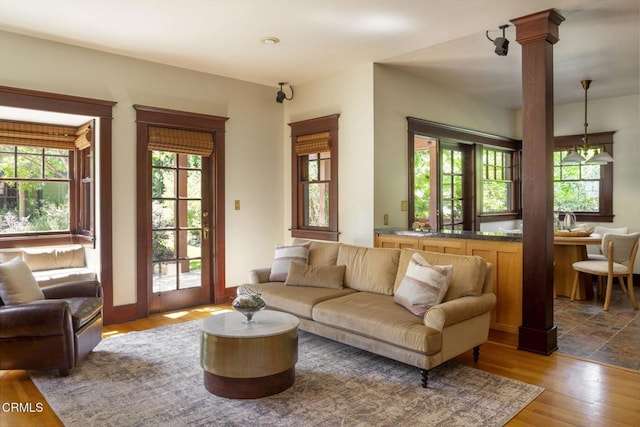 1813 Wayne Ave, South Pasadena, CA 91030 - living area featuring decorative columns, plenty of natural light, and wood finished floors