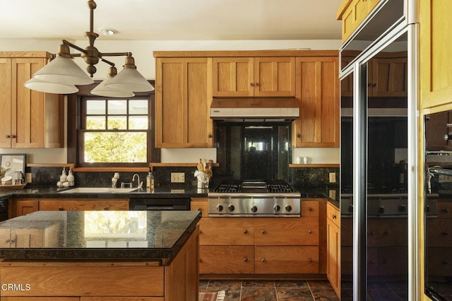 1813 Wayne Ave, South Pasadena, CA 91030 - kitchen with under cabinet range hood, stainless steel gas stovetop, a sink, and brown cabinetry