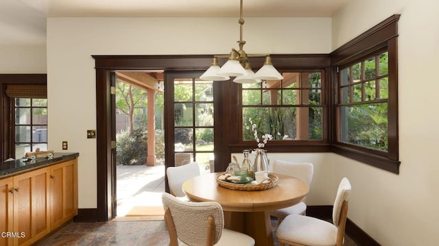 1813 Wayne Ave, South Pasadena, CA 91030 - dining area with baseboards and dark stone finish floors