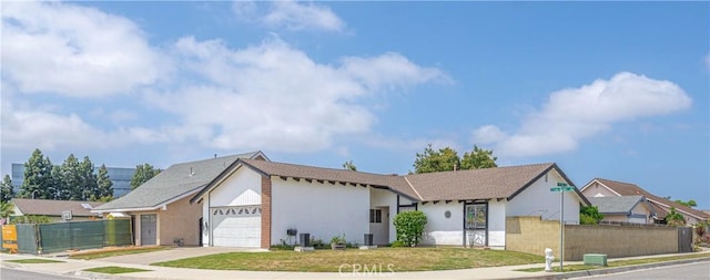 17915 Los Vasos St, Fountain Valley, CA 92708 - ranch-style home with an attached garage, stucco siding, and concrete driveway