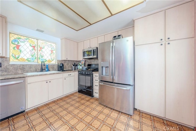 17915 Los Vasos St, Fountain Valley, CA 92708 - kitchen with appliances with stainless steel finishes, light flooring, a sink, and backsplash