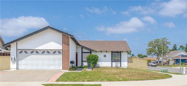 17915 Los Vasos St, Fountain Valley, CA 92708 - view of front facade with concrete driveway, a garage, and a front yard