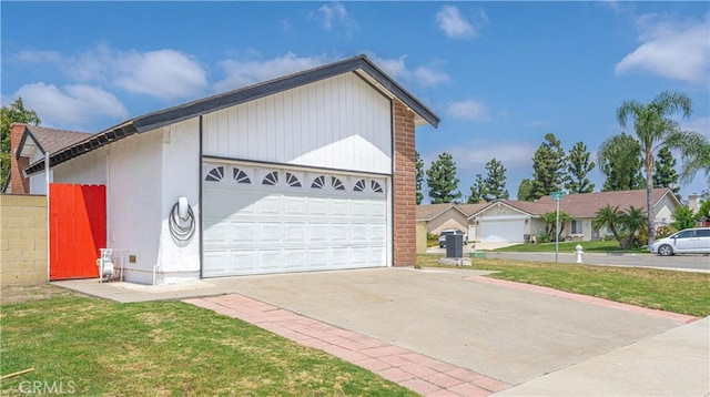 17915 Los Vasos St, Fountain Valley, CA 92708 - view of front of house featuring driveway, a front lawn, and a residential view