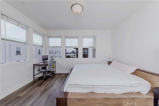 9213 Sunshine Pl, Downey, CA 90240 - bedroom with wood finished floors, baseboards, and a desk