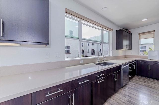 9213 Sunshine Pl, Downey, CA 90240 - kitchen with a sink, plenty of natural light, light wood-type flooring, light countertops, and recessed lighting