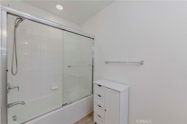 9213 Sunshine Pl, Downey, CA 90240 - bathroom with bath / shower combo with glass door, wood finished floors, and recessed lighting
