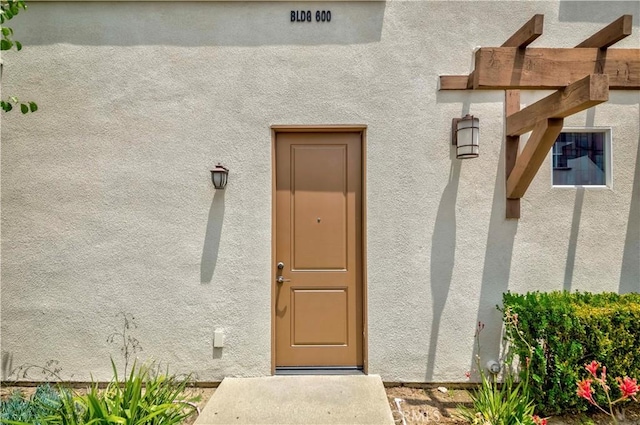 9213 Sunshine Pl, Downey, CA 90240 - view of exterior entry with stucco siding