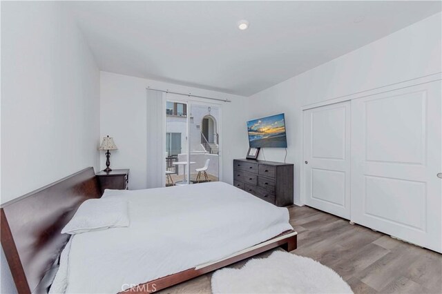 9213 Sunshine Pl, Downey, CA 90240 - bedroom featuring wood finished floors, french doors, and a closet