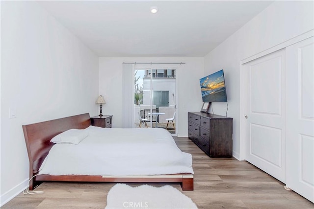 9213 Sunshine Pl, Downey, CA 90240 - bedroom with light wood finished floors, baseboards, access to exterior, and recessed lighting
