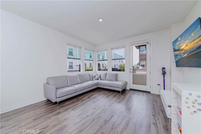 9213 Sunshine Pl, Downey, CA 90240 - living area with wood finished floors, recessed lighting, and baseboards