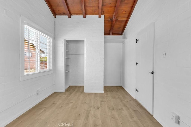 6365 Cahuilla Ave Unit 29, Palms, CA 92277 - unfurnished bedroom featuring wooden ceiling with exposed beams and light wood-type flooring