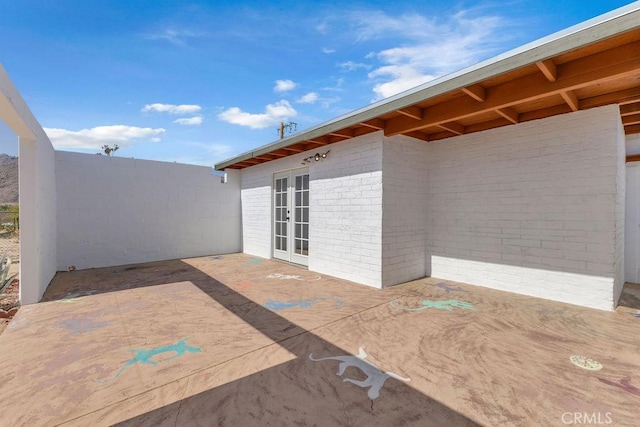 6365 Cahuilla Ave Unit 29, Palms, CA 92277 - view of patio featuring french doors