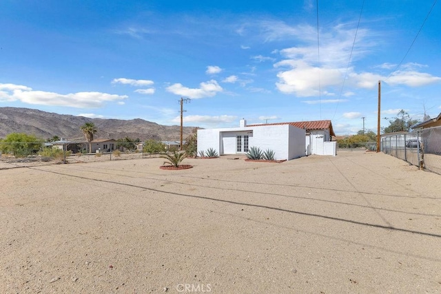 6365 Cahuilla Ave Unit 29, Palms, CA 92277 - rear view of property featuring a mountain view and stucco siding