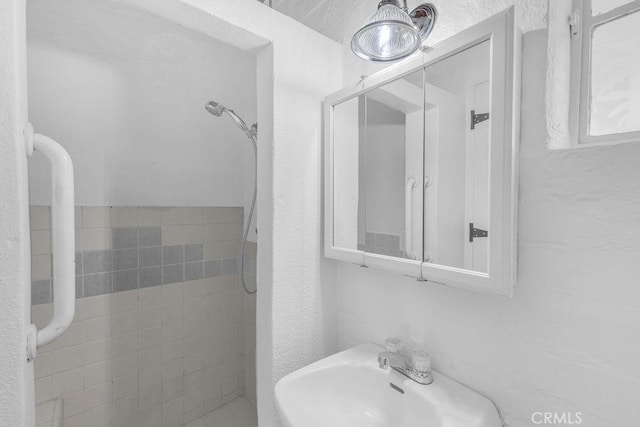 6365 Cahuilla Ave Unit 29, Palms, CA 92277 - full bath featuring a sink and a tile shower