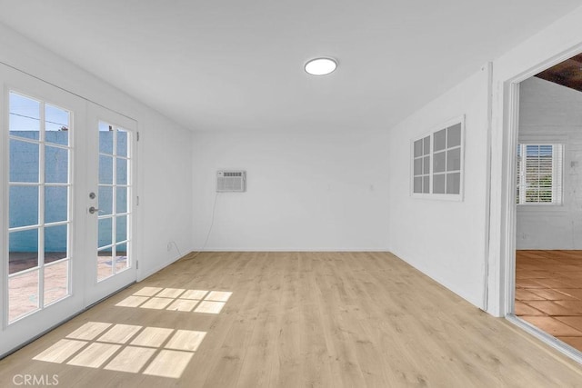 6365 Cahuilla Ave Unit 29, Palms, CA 92277 - unfurnished room featuring healthy amount of natural light, french doors, and wood finished floors
