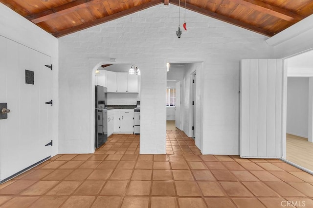 6365 Cahuilla Ave Unit 29, Palms, CA 92277 - unfurnished living room featuring wooden ceiling, light tile patterned floors, arched walkways, and ornate columns