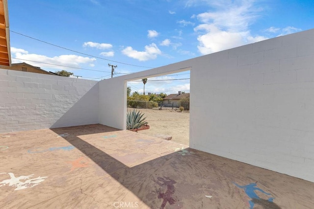 6365 Cahuilla Ave Unit 29, Palms, CA 92277 - fenced backyard featuring a patio area
