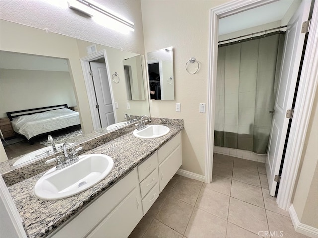 1763 Eastview Ave, Upland, CA 91784 - ensuite bathroom with baseboards, double vanity, and tile patterned floors