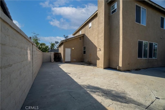 5840 Redhaven St, Eastvale, CA 92880 - view of home's exterior with stucco siding and a patio