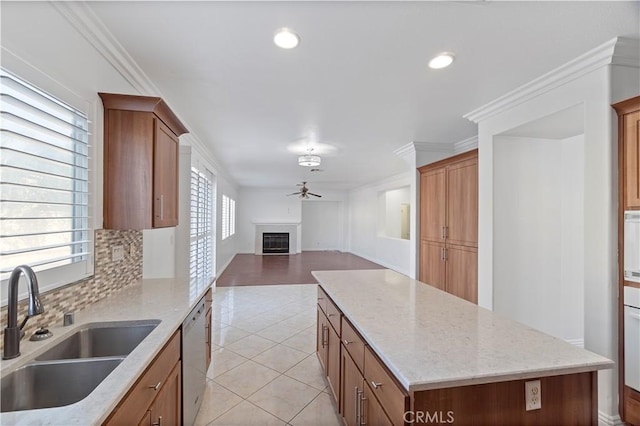 5840 Redhaven St, Eastvale, CA 92880 - kitchen featuring a sink, ceiling fan, stainless steel dishwasher, a center island, and open floor plan