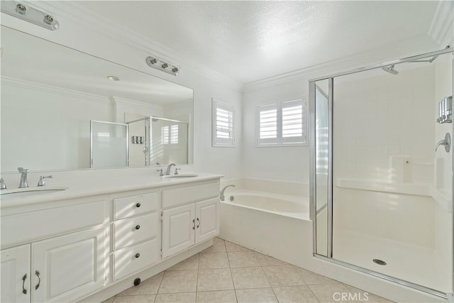5840 Redhaven St, Eastvale, CA 92880 - bathroom featuring a stall shower, a garden tub, double vanity, tile patterned floors, and crown molding