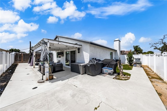 1138 Millstream Ln, Corona, CA 92878 - rear view of property with a patio, a chimney, an outdoor hangout area, and a fenced backyard