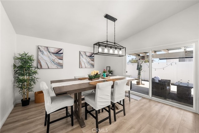 1138 Millstream Ln, Corona, CA 92878 - dining space featuring vaulted ceiling, light wood-style flooring, and baseboards