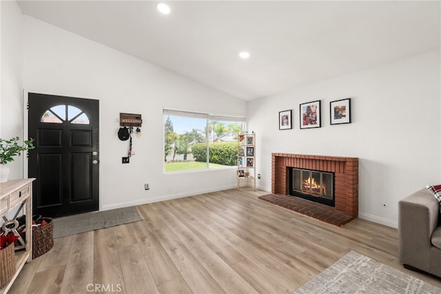 1138 Millstream Ln, Corona, CA 92878 - living room with light wood-style flooring, recessed lighting, a brick fireplace, baseboards, and high vaulted ceiling