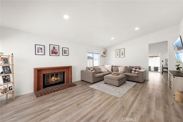 1138 Millstream Ln, Corona, CA 92878 - living area with light wood-type flooring, a fireplace, recessed lighting, and baseboards