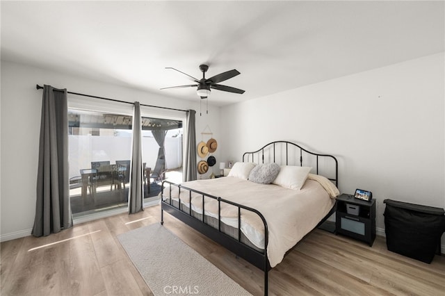 1138 Millstream Ln, Corona, CA 92878 - bedroom featuring light wood-style flooring, access to outside, a ceiling fan, and baseboards