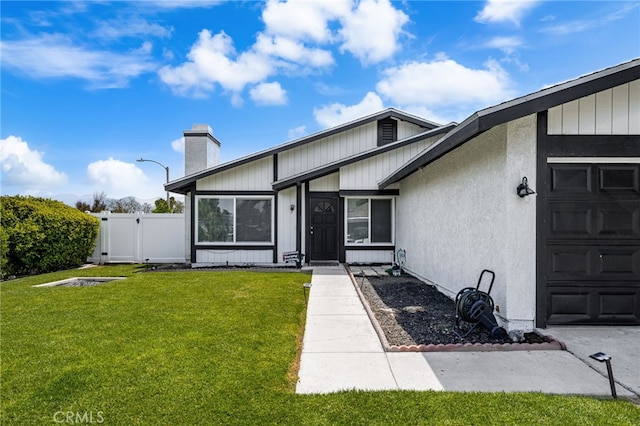 1138 Millstream Ln, Corona, CA 92878 - doorway to property with a garage, a chimney, and a gate