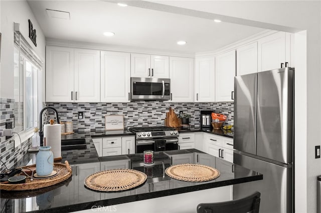 1138 Millstream Ln, Corona, CA 92878 - kitchen featuring stainless steel appliances, decorative backsplash, a sink, and white cabinets
