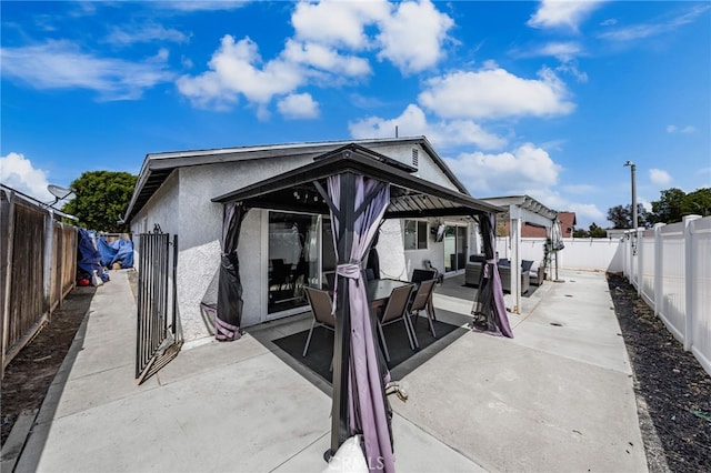 1138 Millstream Ln, Corona, CA 92878 - fenced backyard with a patio area, an outdoor hangout area, and a gazebo